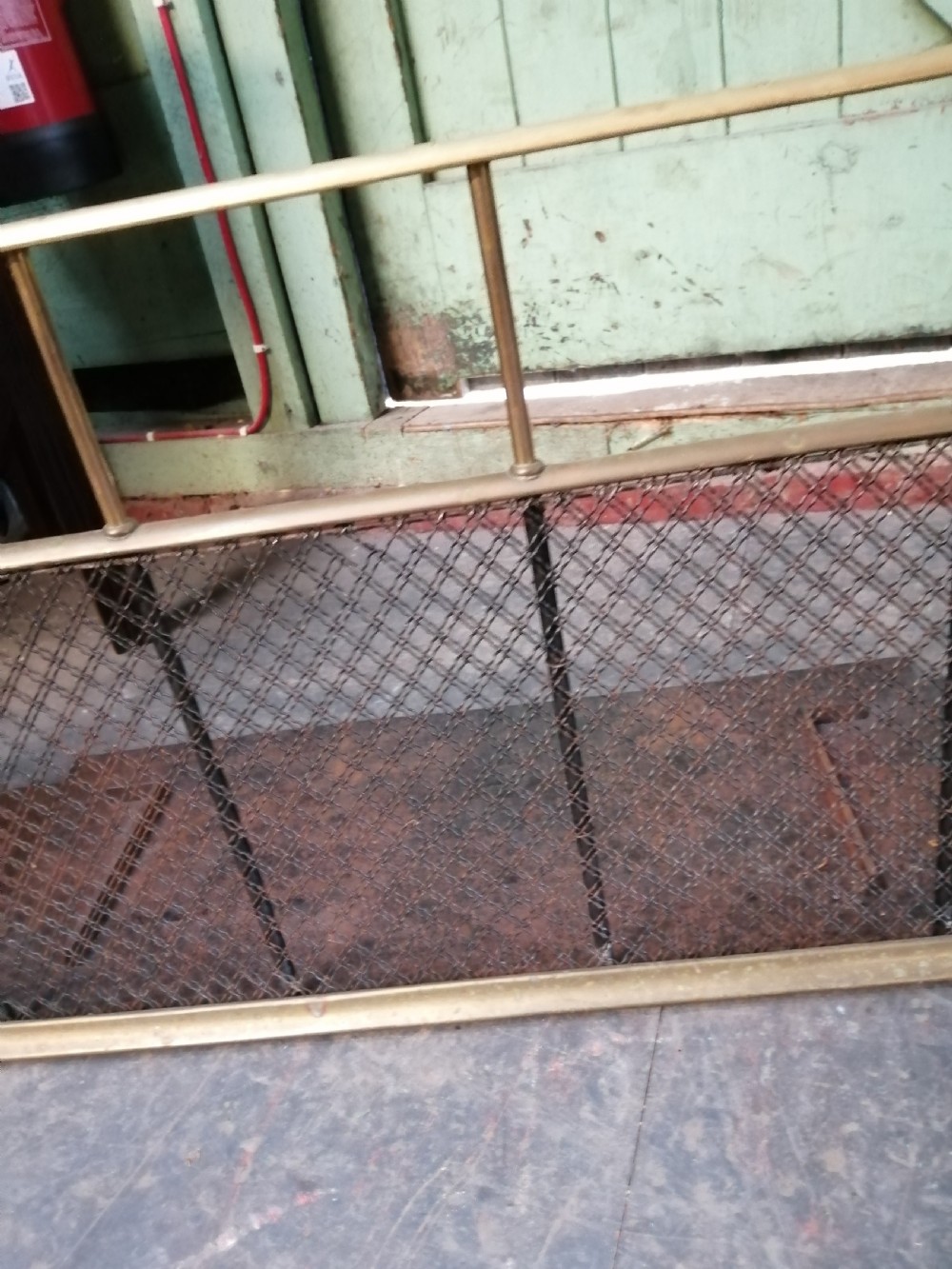 An attractive brass and mesh spark fender. View XV