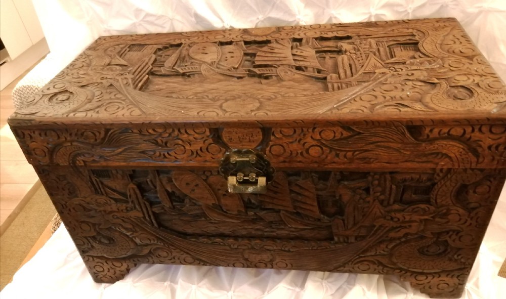 An antique carved camphor trunk.