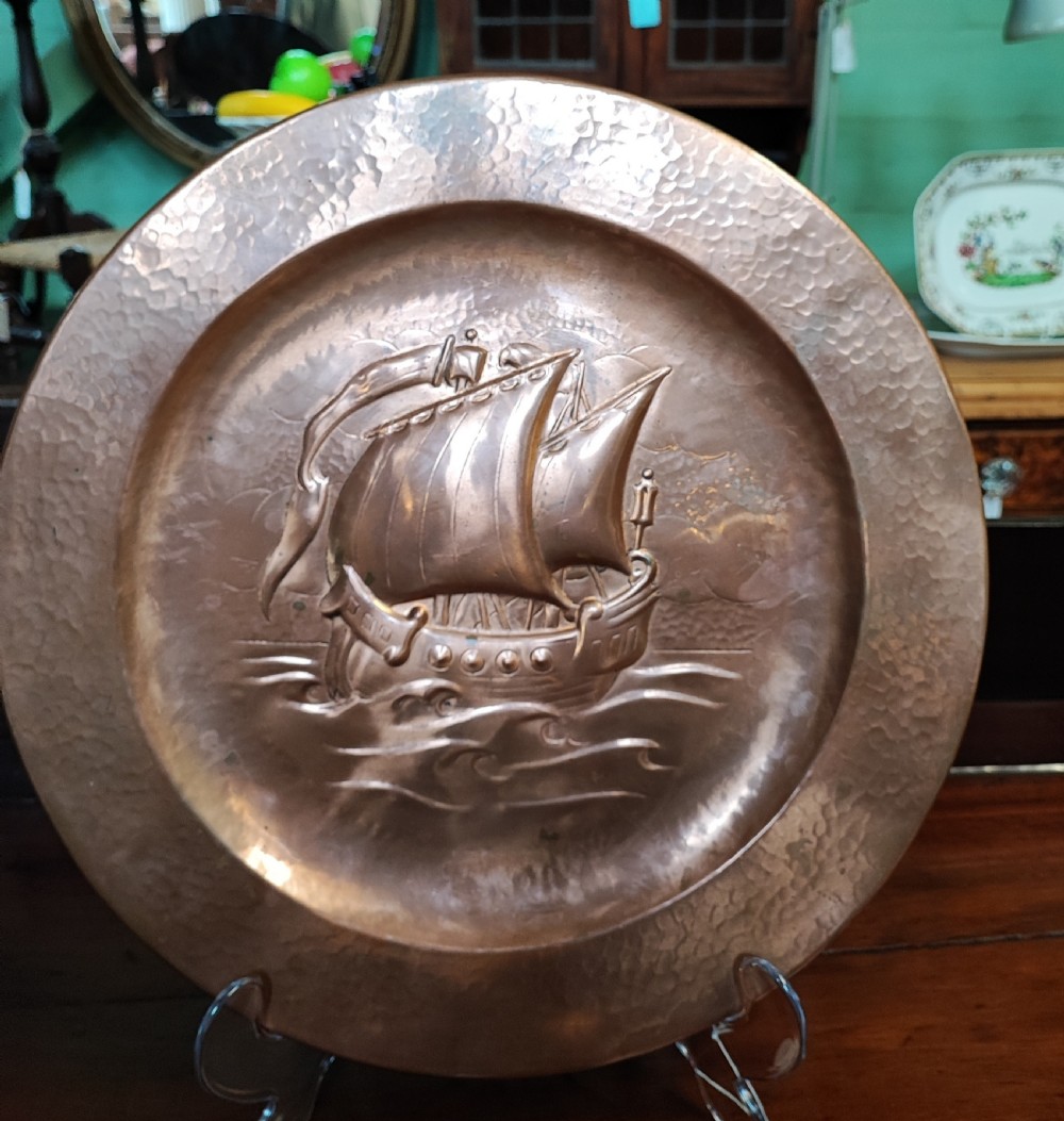 Art's and crafts copper gallion charger.