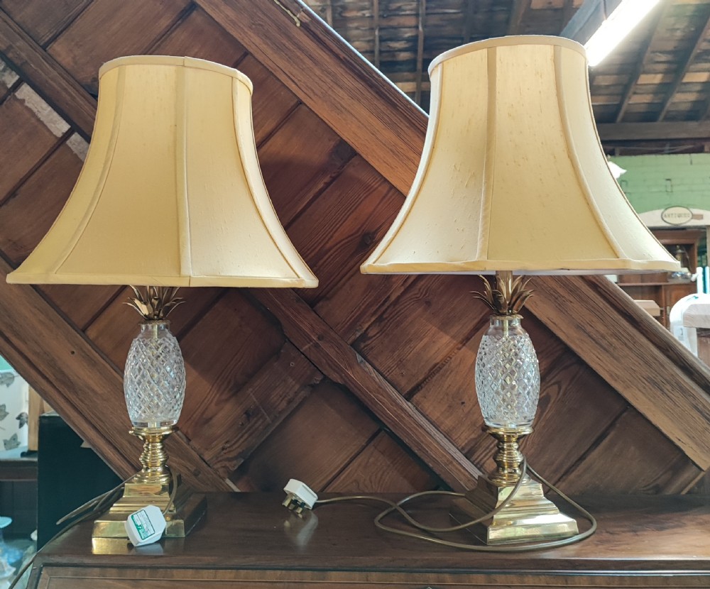 A pair of art Deco pineapple  table lamps in gilt brass and crystal.