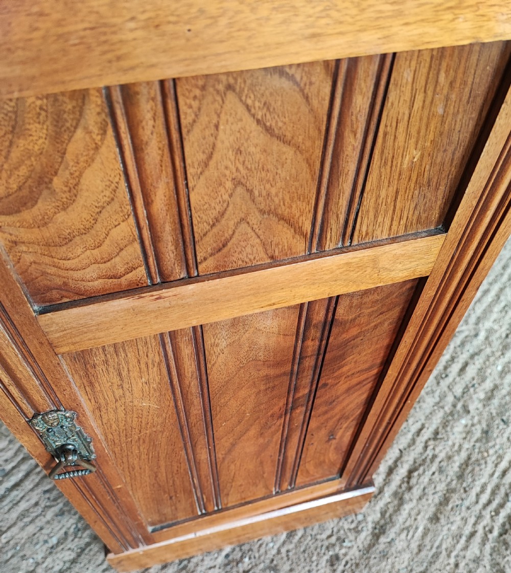 An Edwardian walnut bedside cabinet. View II