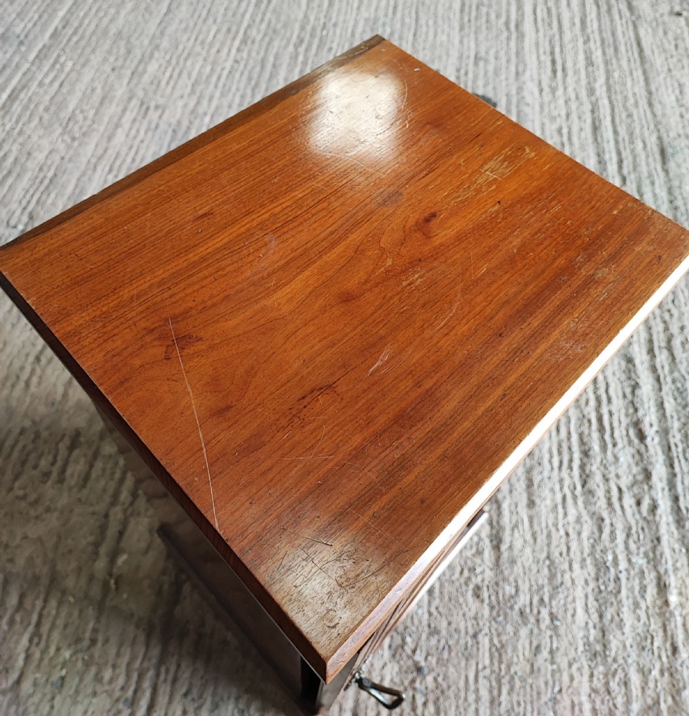 An Edwardian walnut bedside cabinet. View III