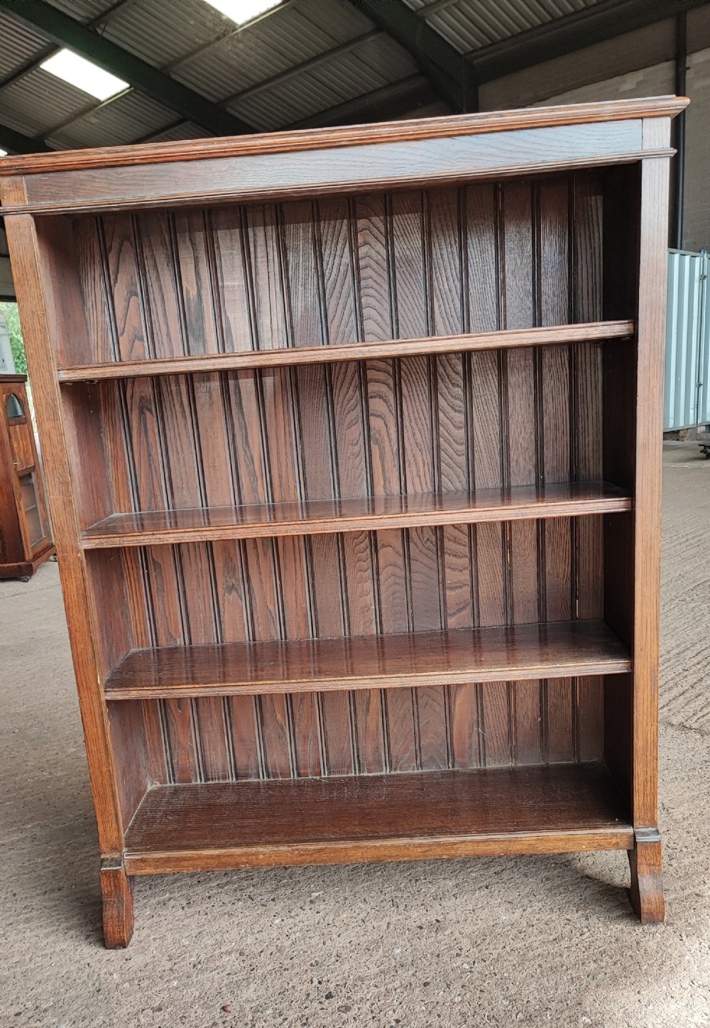 An Edwardian solid oak open bookcase.