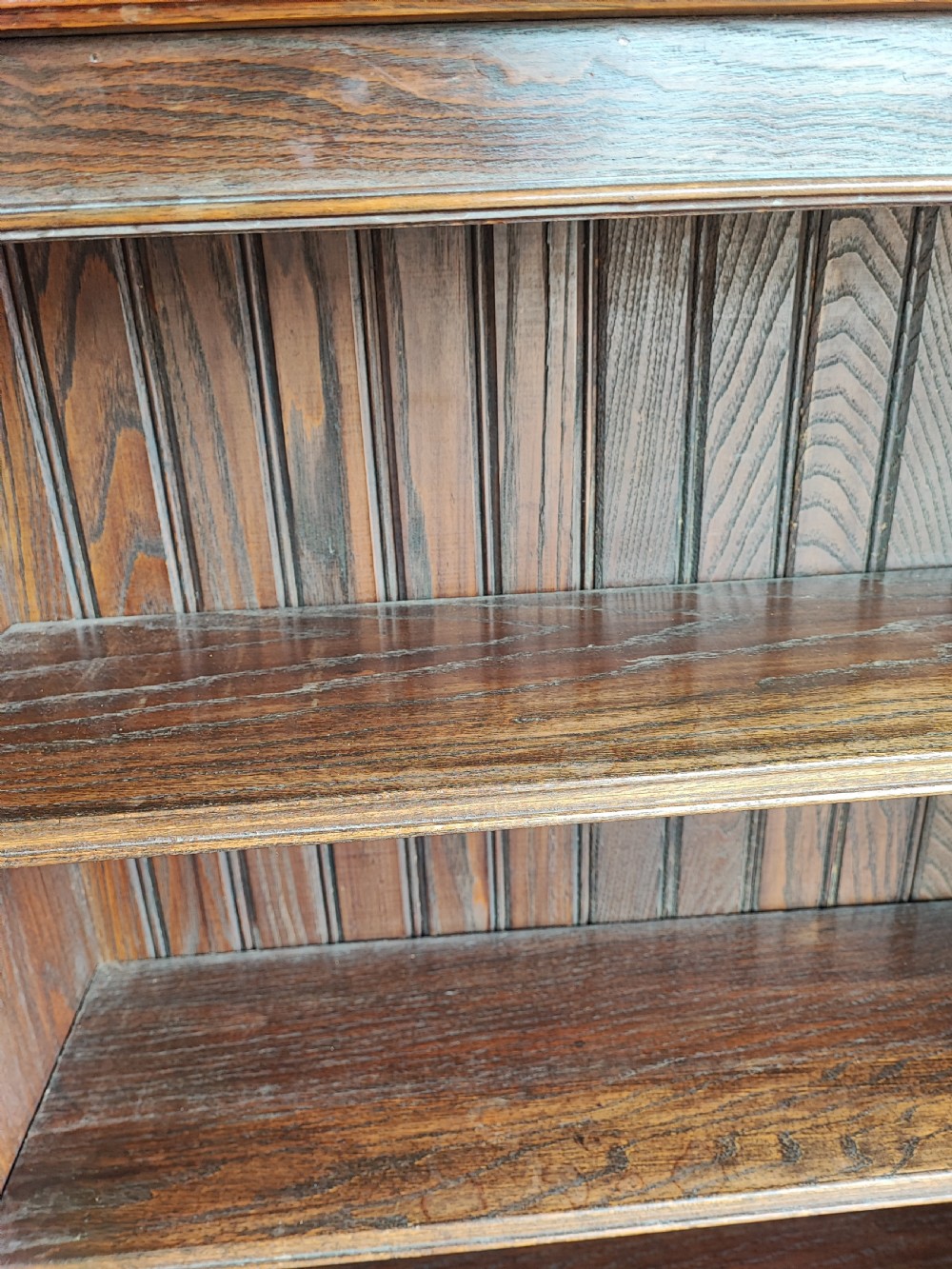 An Edwardian solid oak open bookcase. View IV