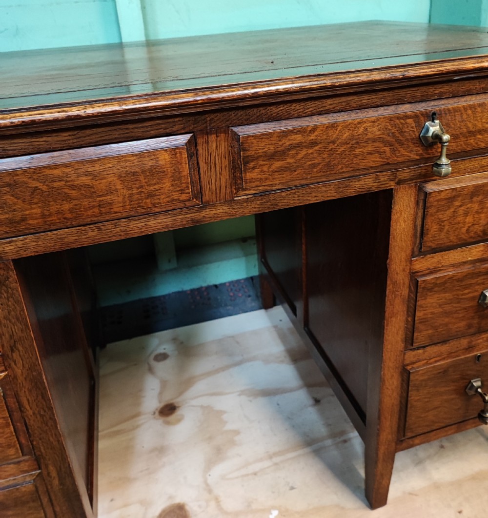 Antique Edwardian oak pedestal desk. View II