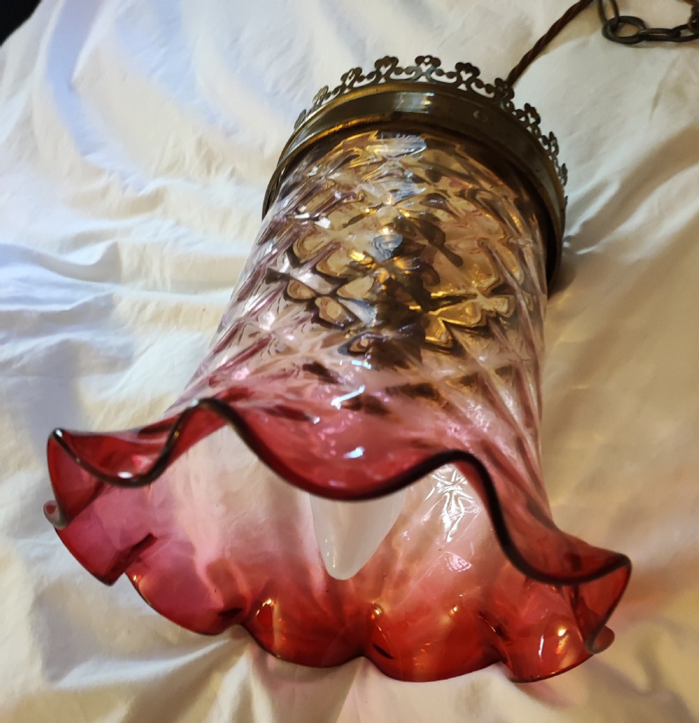 A fine Victorian cranberry glass hanging light fitting. View II
