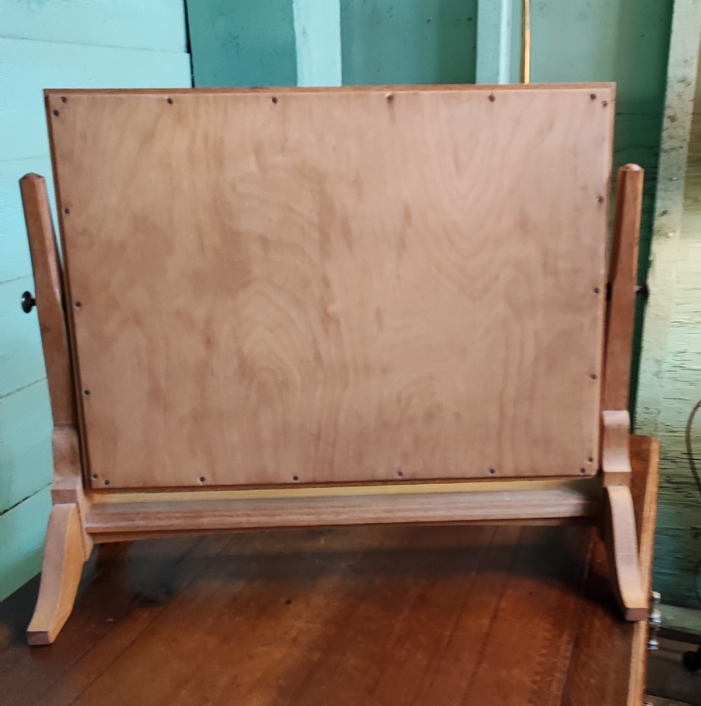 An antique pale oak Cotswold dressing mirror. View IV