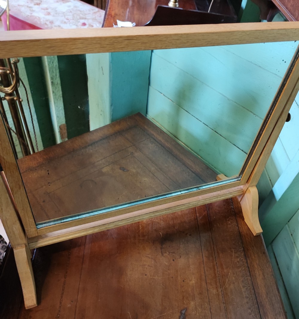 An antique pale oak Cotswold dressing mirror. View IX