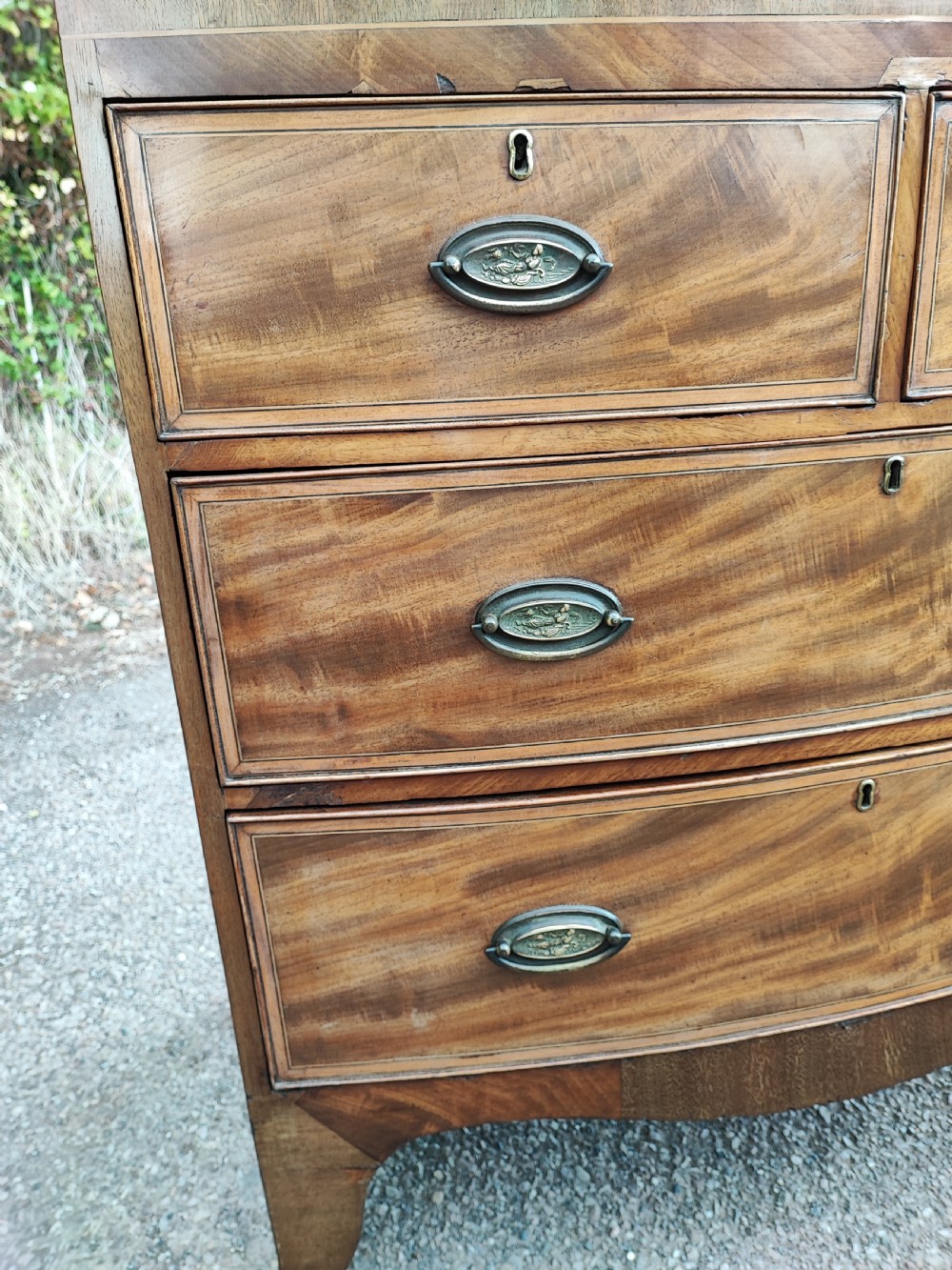 An antique regency inlaid bow front chest  View IV