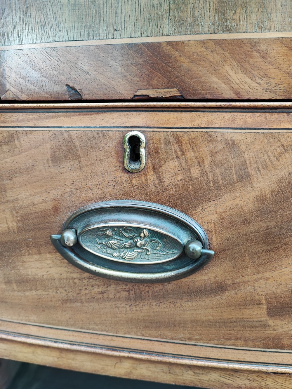 An antique regency inlaid bow front chest  View V