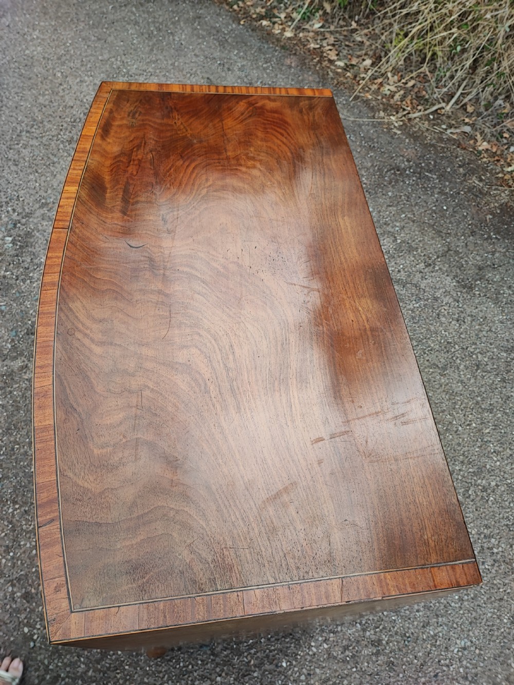 An antique regency inlaid bow front chest  View VI