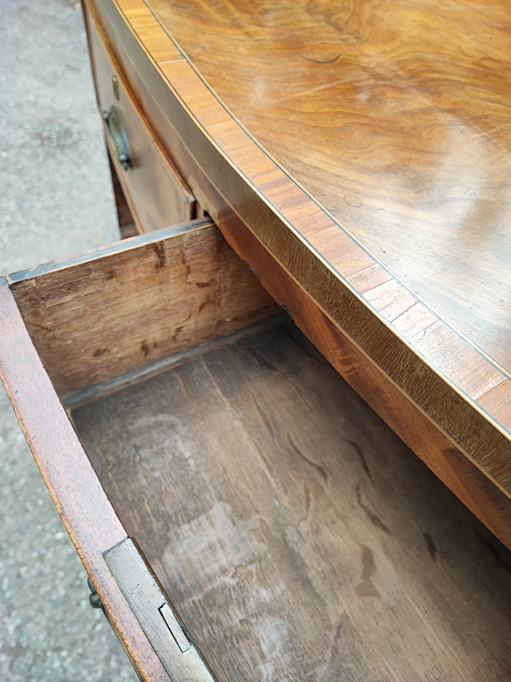 An antique regency inlaid bow front chest  View VII
