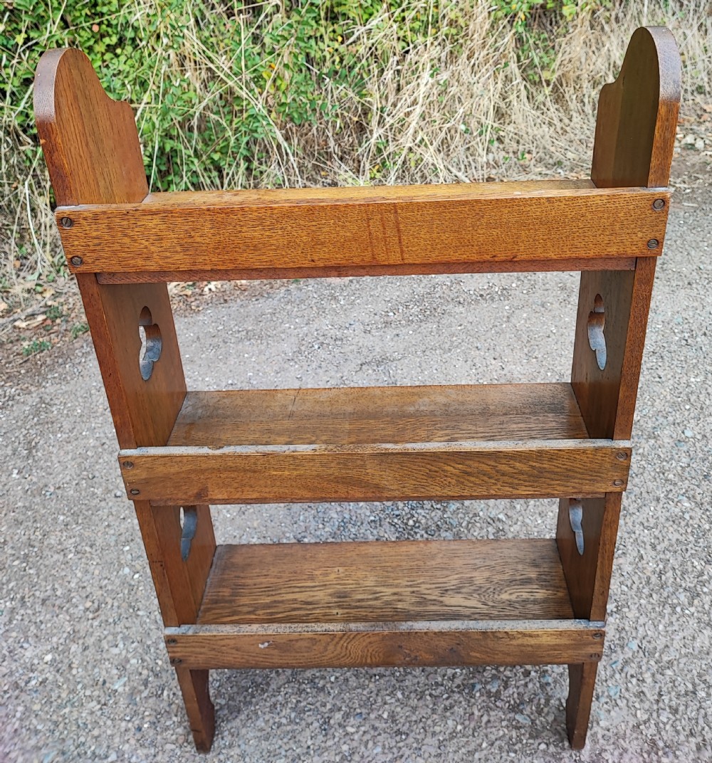 An Arts and Crafts liberty's of London open bookcase. View IV