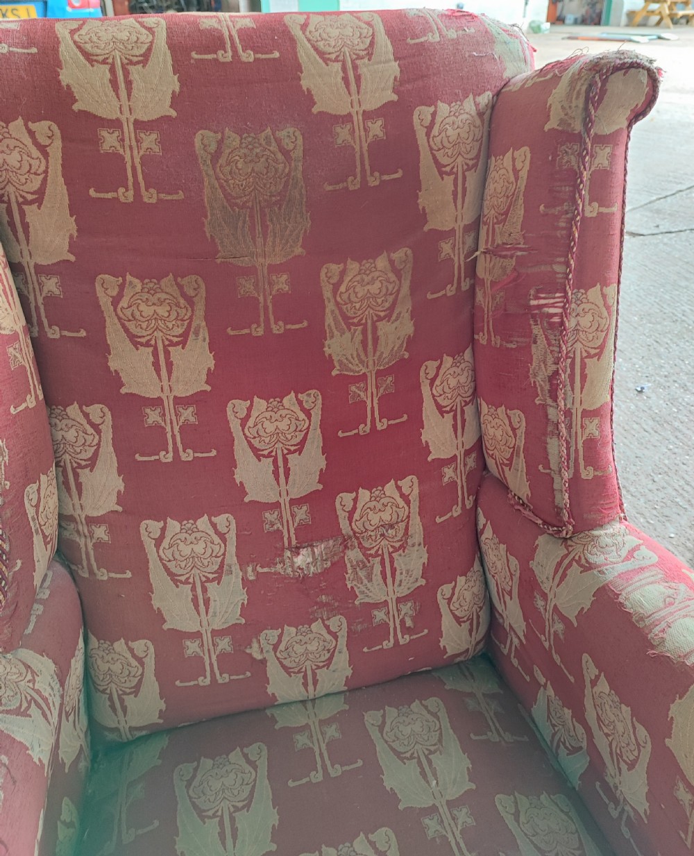 An Arts and Crafts wing arm  chair with original upholstery. View II