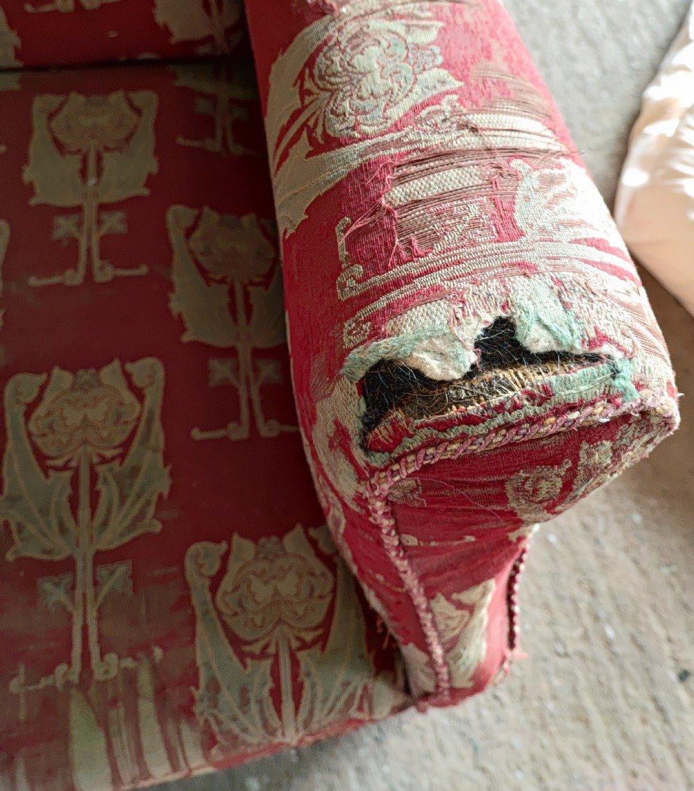 An Arts and Crafts wing arm  chair with original upholstery. View III