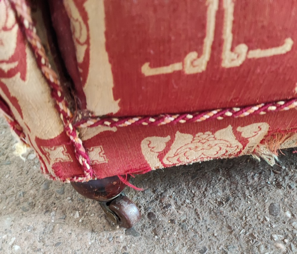 An Arts and Crafts wing arm  chair with original upholstery. View IV
