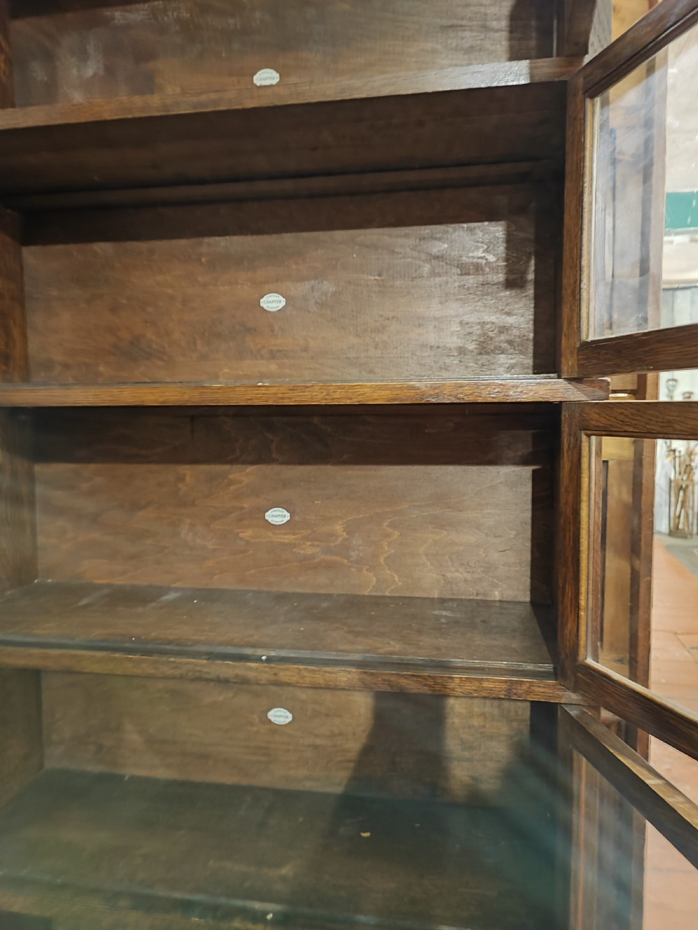 Antique oak stacking sectional bookcase by Simpoles of Manchester. View II