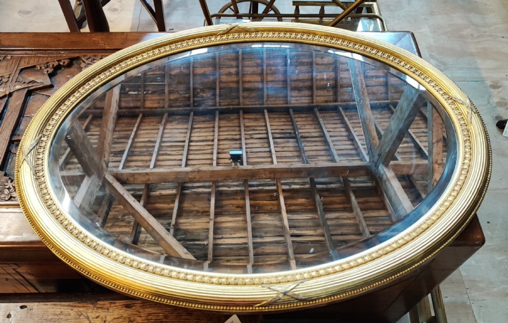Edwardian oval Gilt mirror.