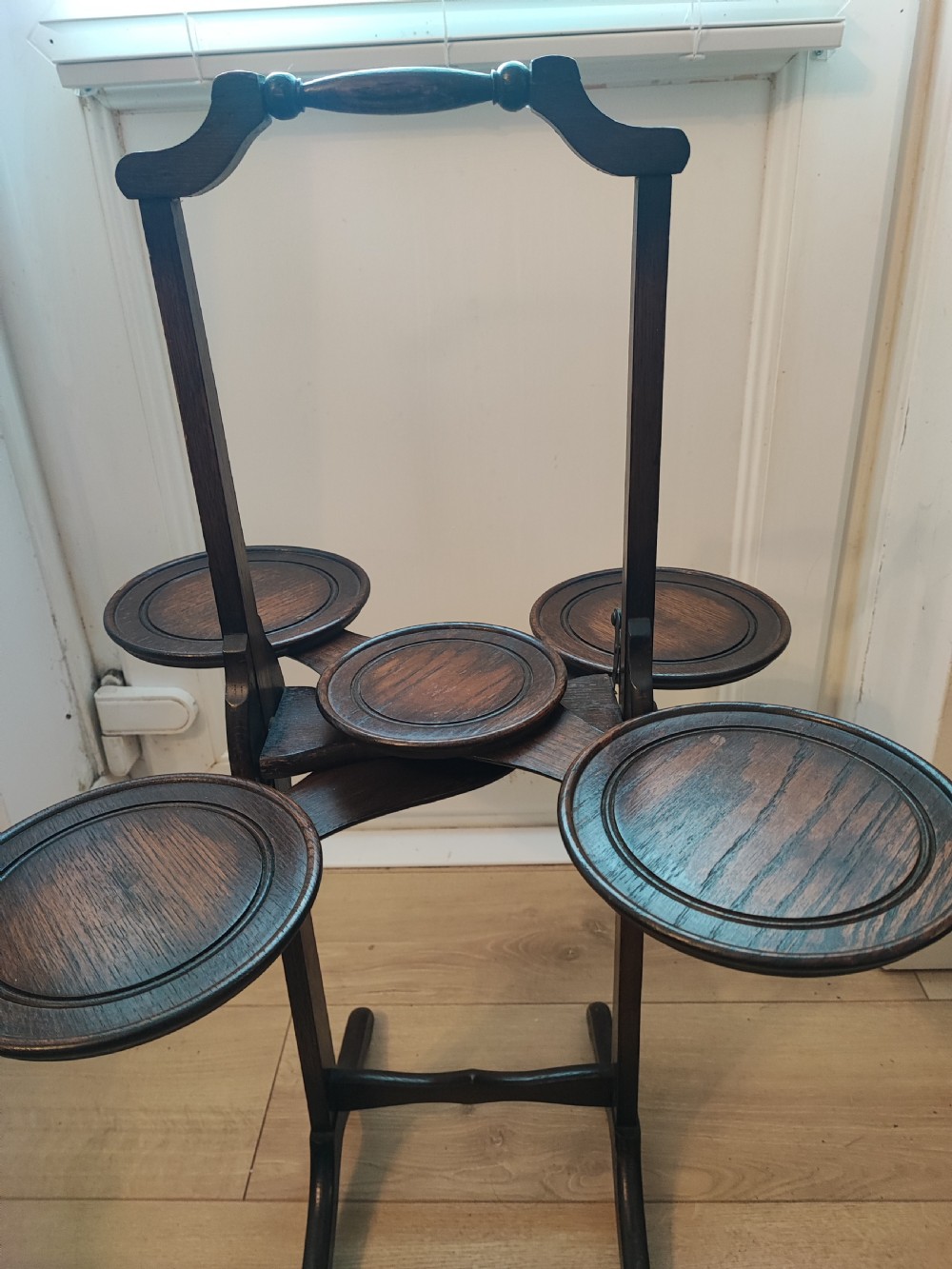 An antique oak  cake stand.
