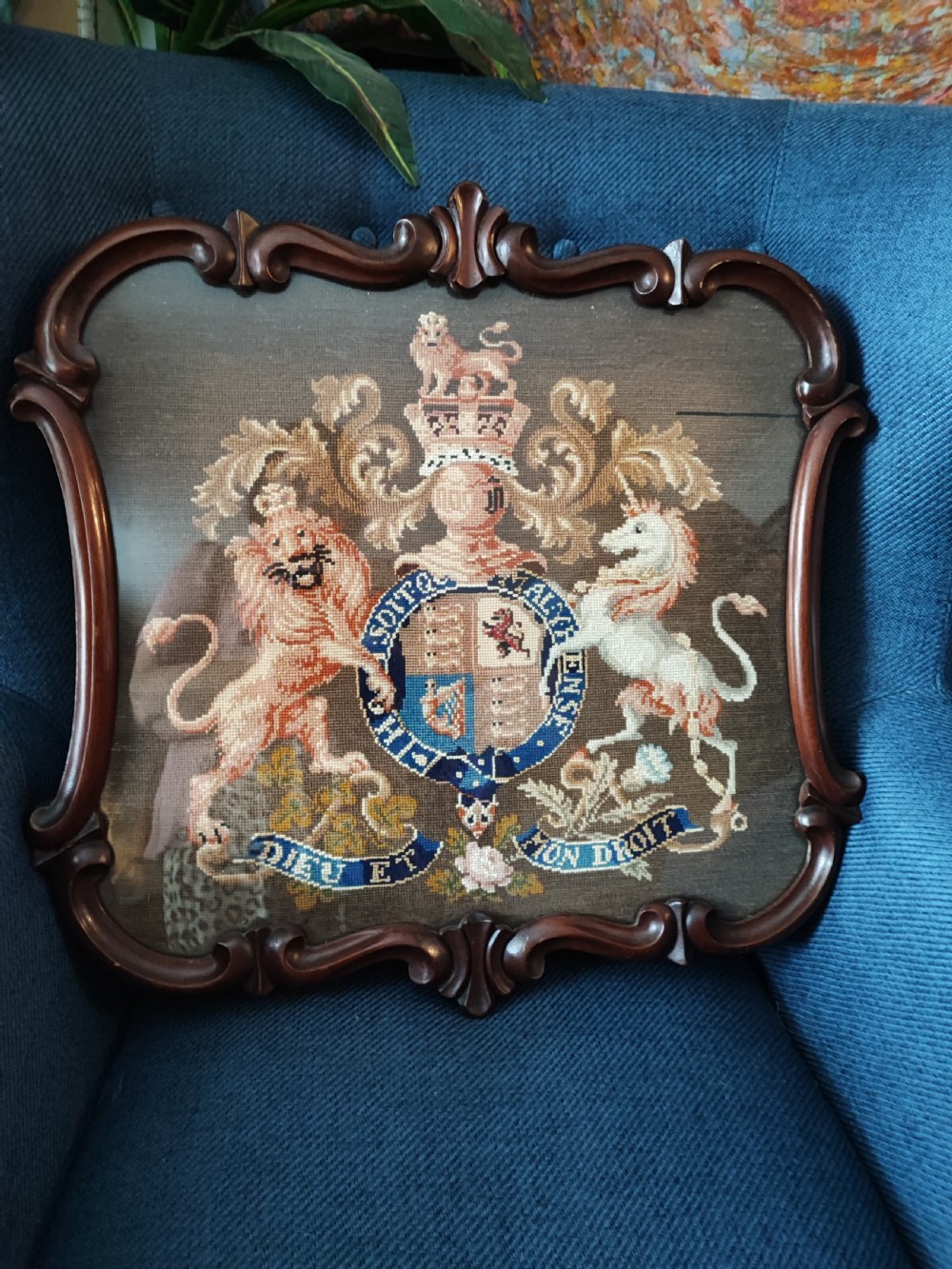 A Victorian Berlin woolwork featuring the royal military coat of arms. 