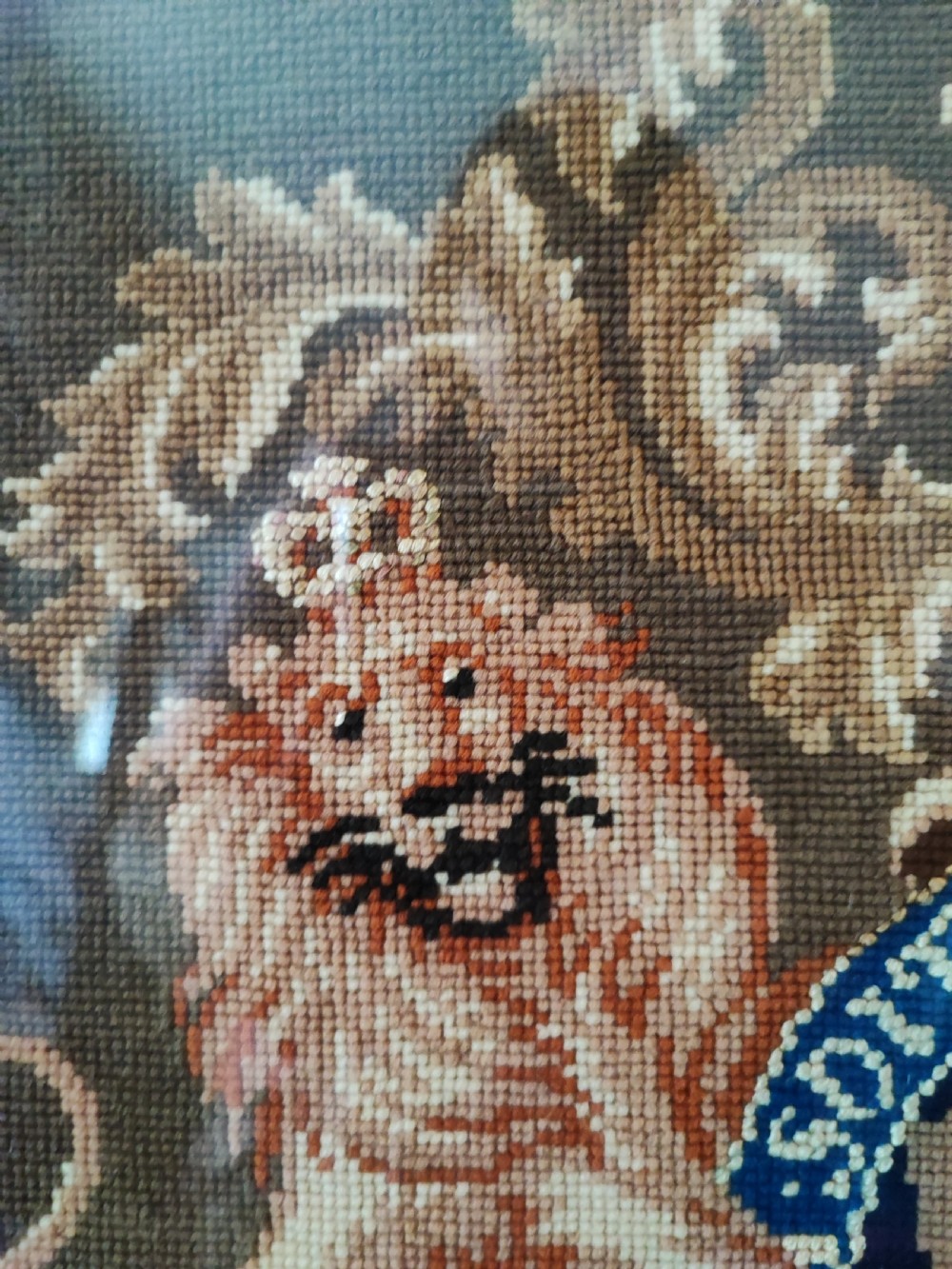 A Victorian Berlin woolwork featuring the royal military coat of arms.  View II