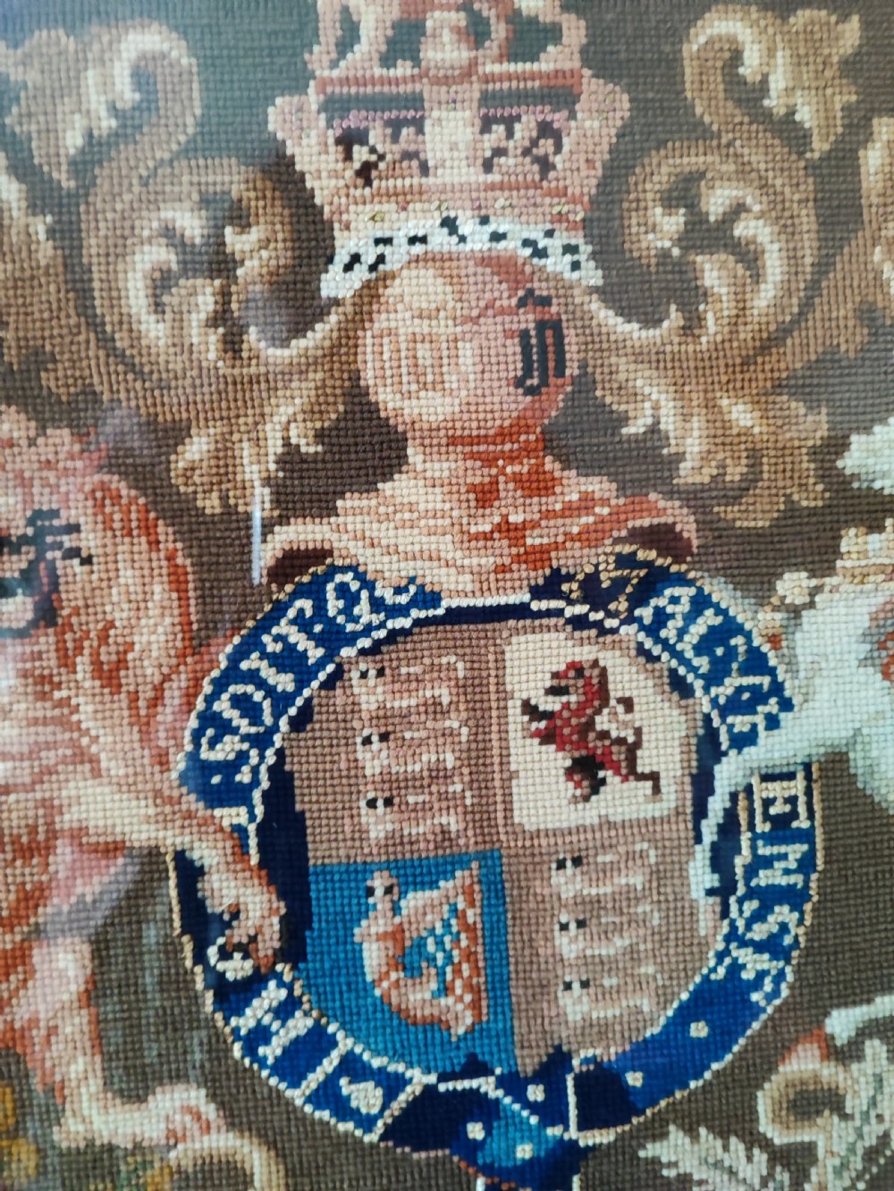 A Victorian Berlin woolwork featuring the royal military coat of arms.  View III