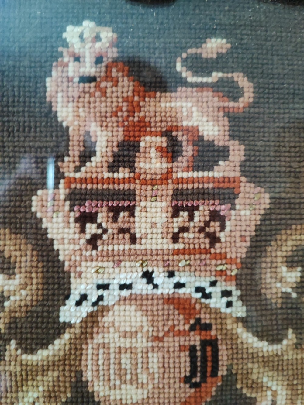 A Victorian Berlin woolwork featuring the royal military coat of arms.  View X