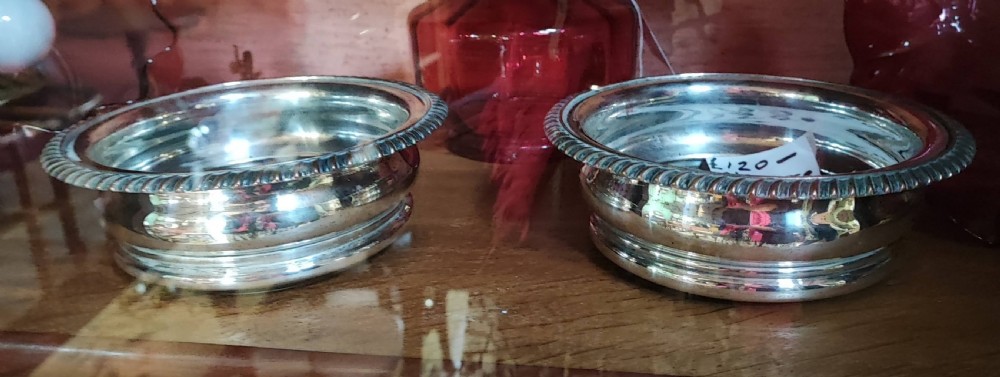 A pair of Sheffield plate bottle coasters. 