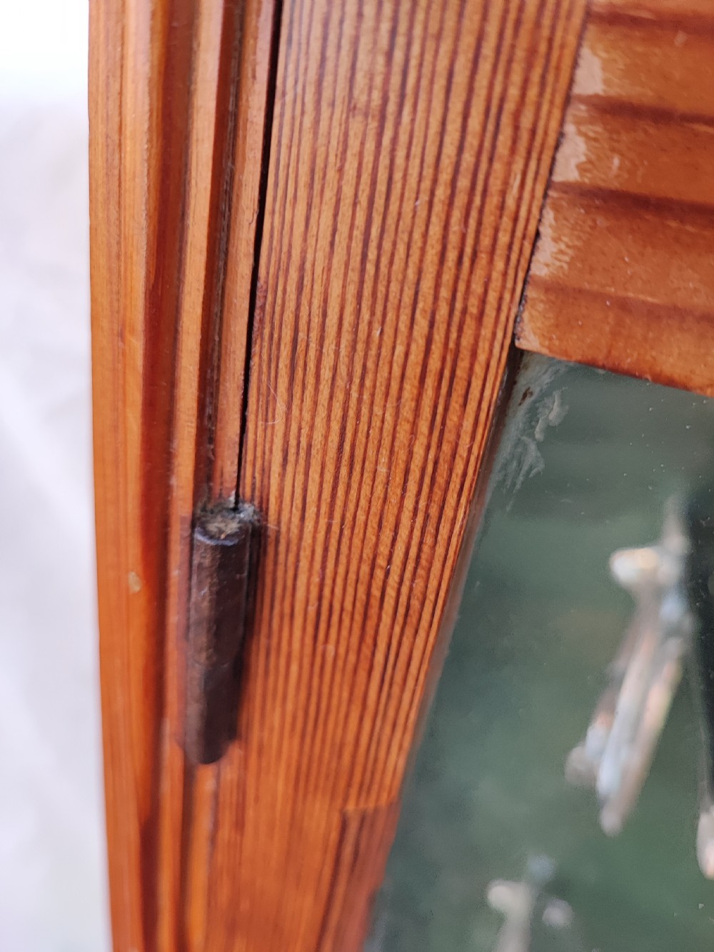 A 19c carved pine wall hanging cabinet. View IV