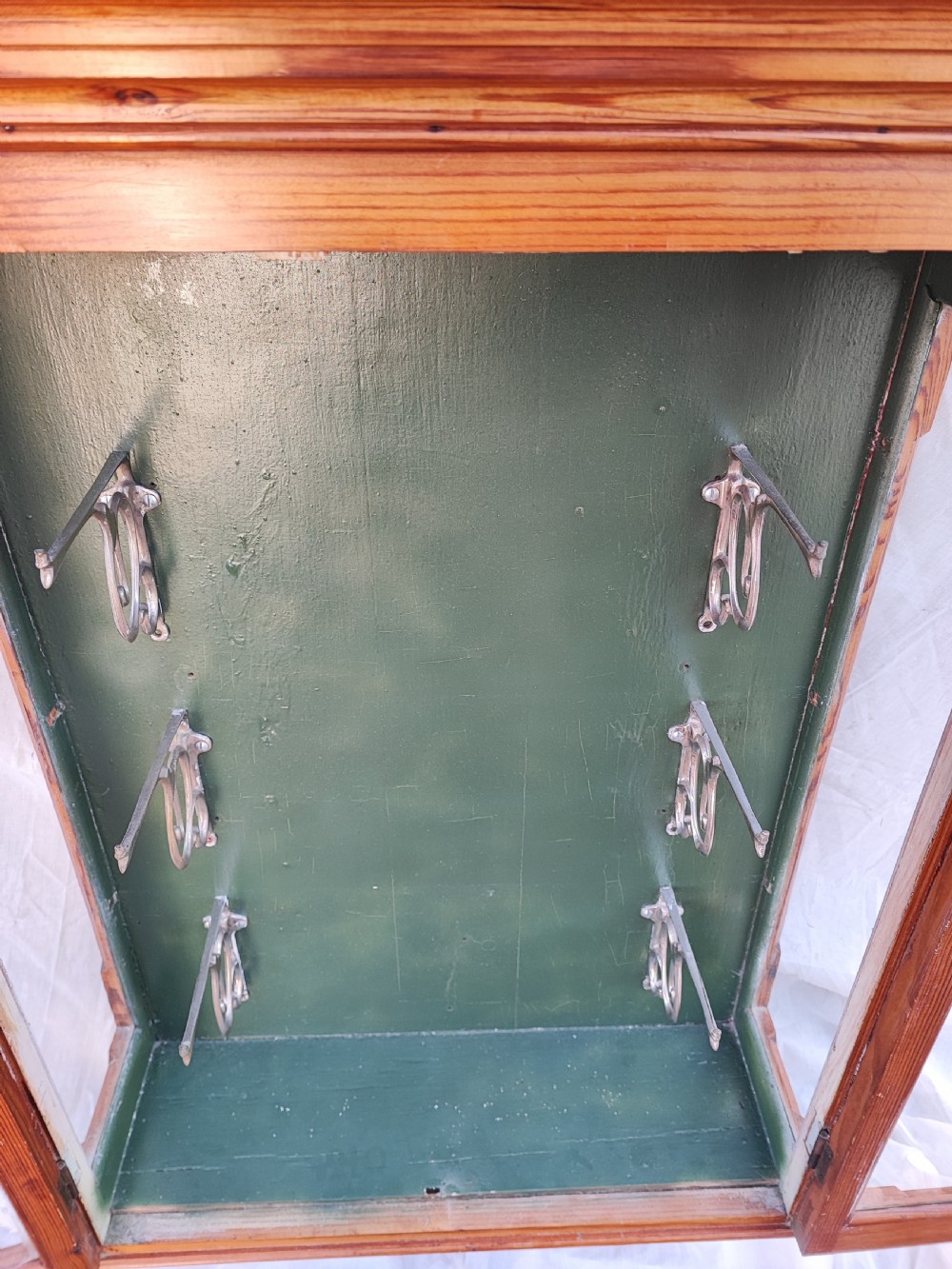 A 19c carved pine wall hanging cabinet. View V
