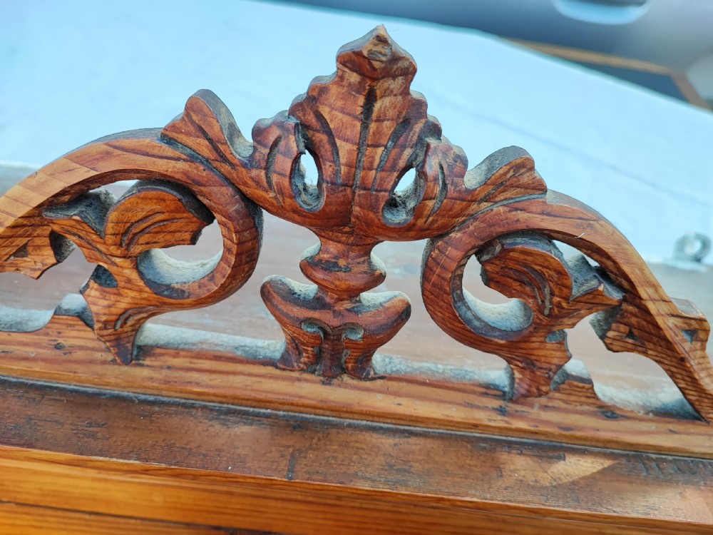 A 19c carved pine wall hanging cabinet. View VII