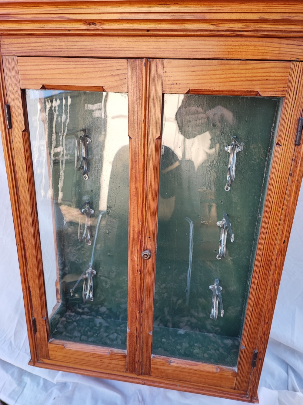 A 19c carved pine wall hanging cabinet. View XIV