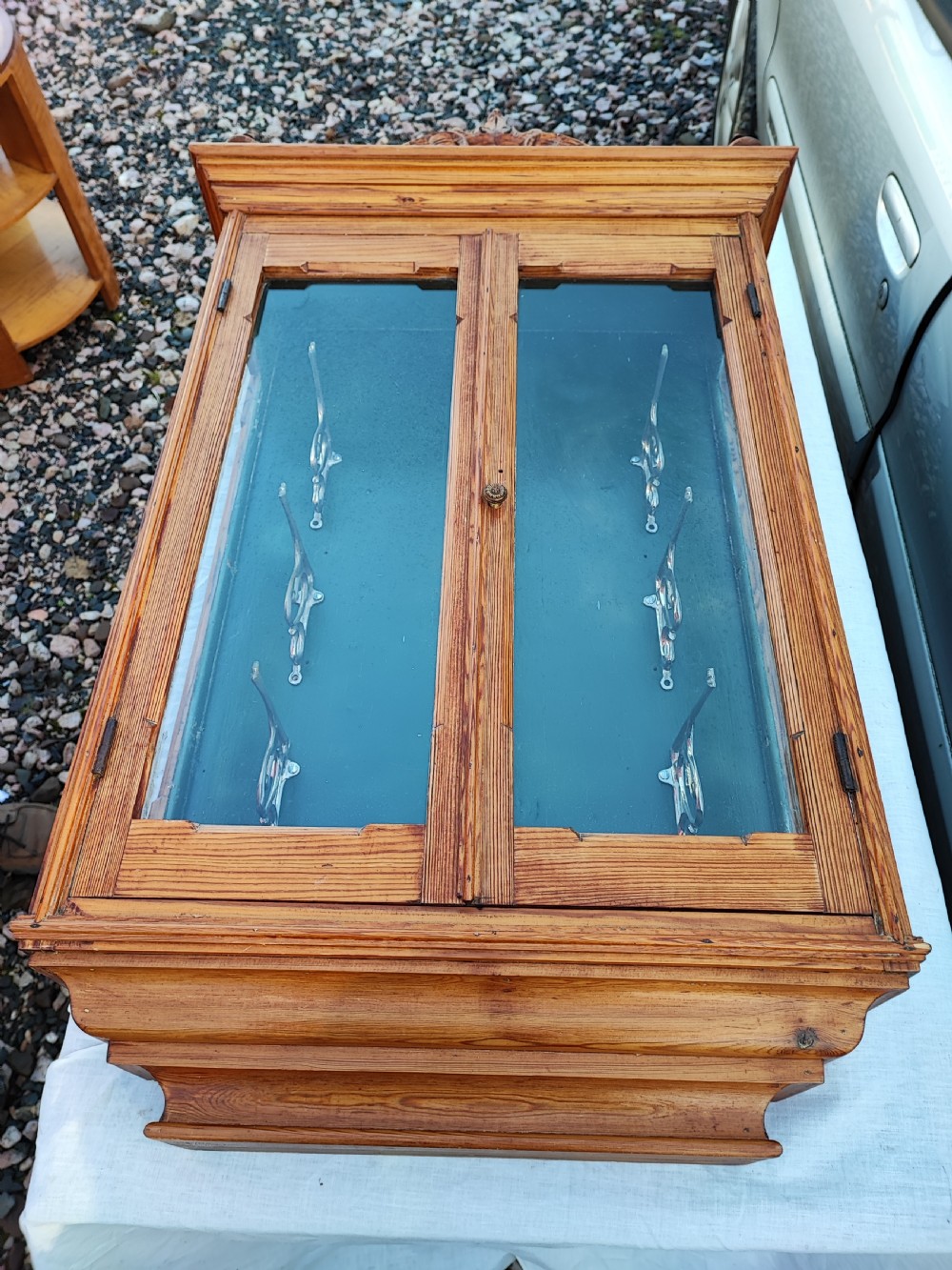 A 19c carved pine wall hanging cabinet. View XX