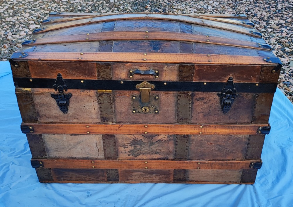 A 19 c tooled leather and mahogany steamer, carriage trunk.