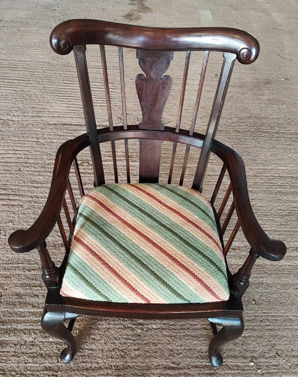 A quality mahogany Windsor armchair by Birch and co for liberty of London.