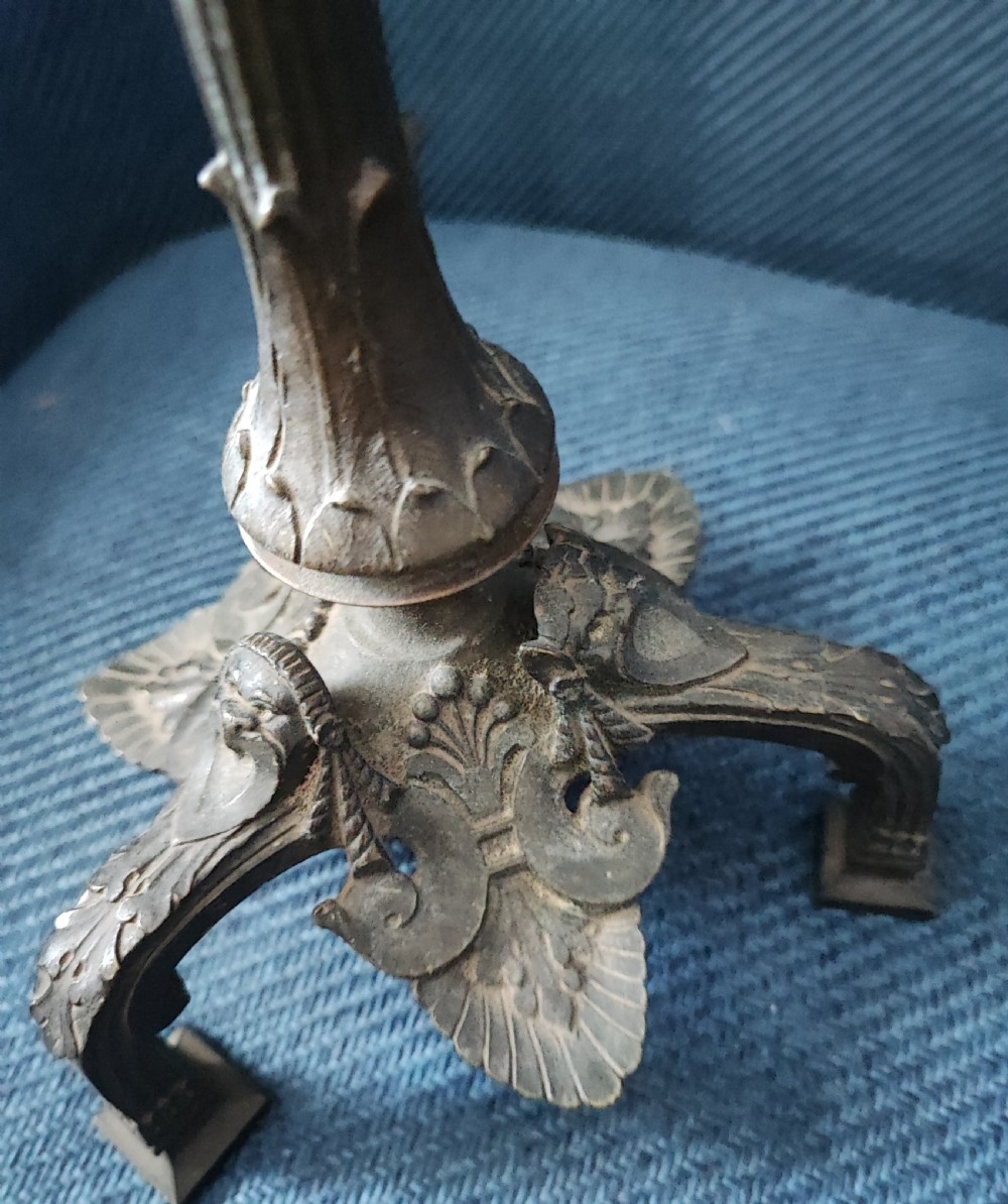A pair of 19c bronze and gilt candle sticks. View III