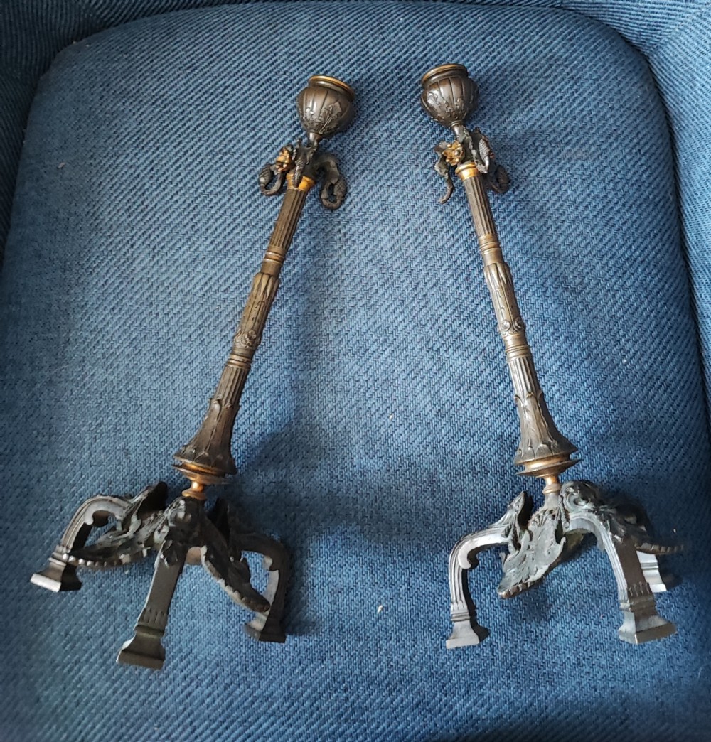 A pair of 19c bronze and gilt candle sticks. View V