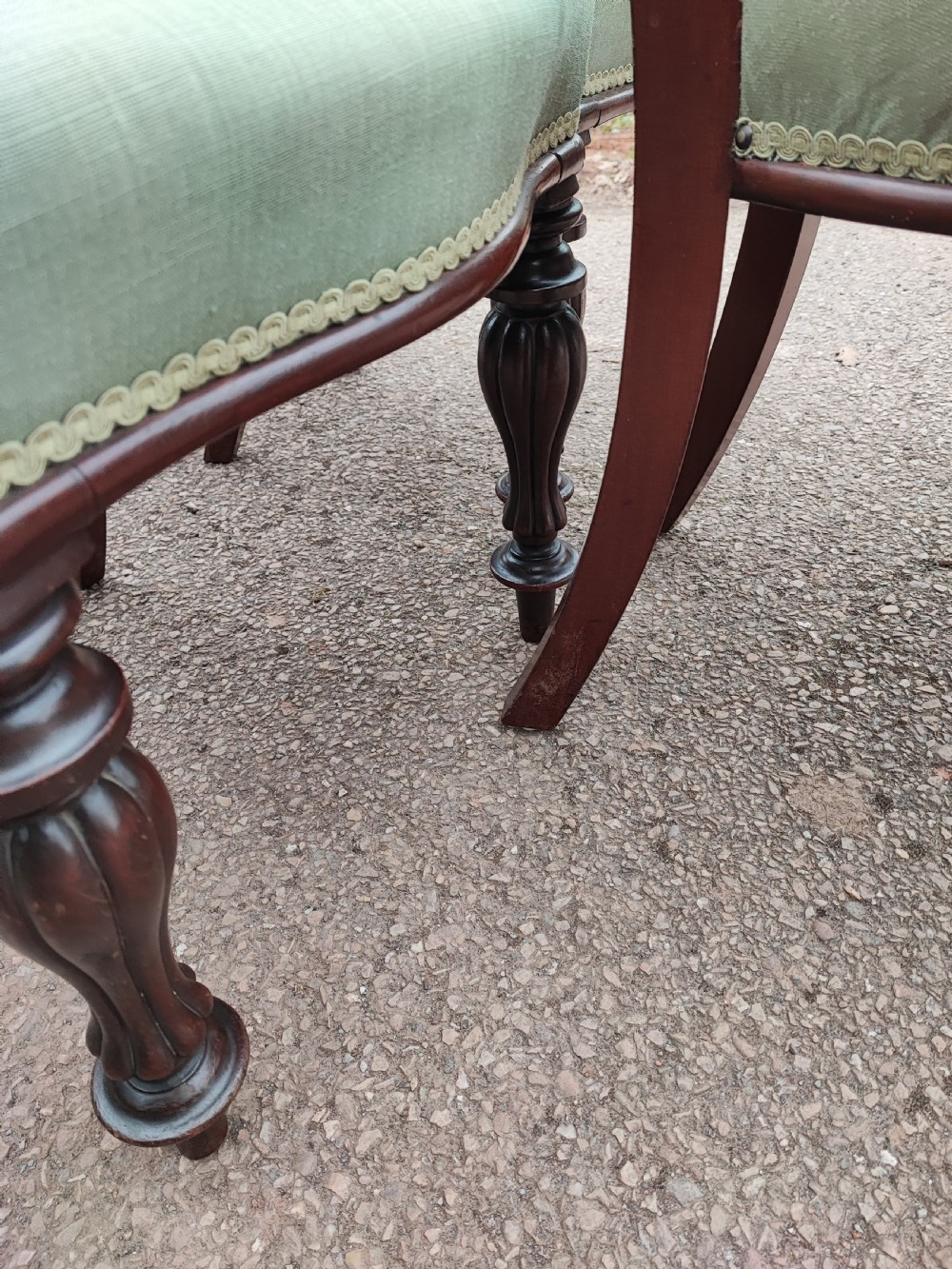 A set of six Victorian balloon back dining chairs made of dark mahogany wood with soft green upholstered seats. View III