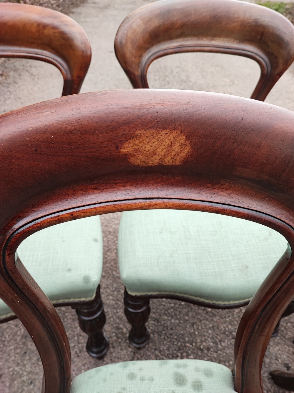 A set of six Victorian balloon back dining chairs made of dark mahogany wood with soft green upholstered seats. View VIII