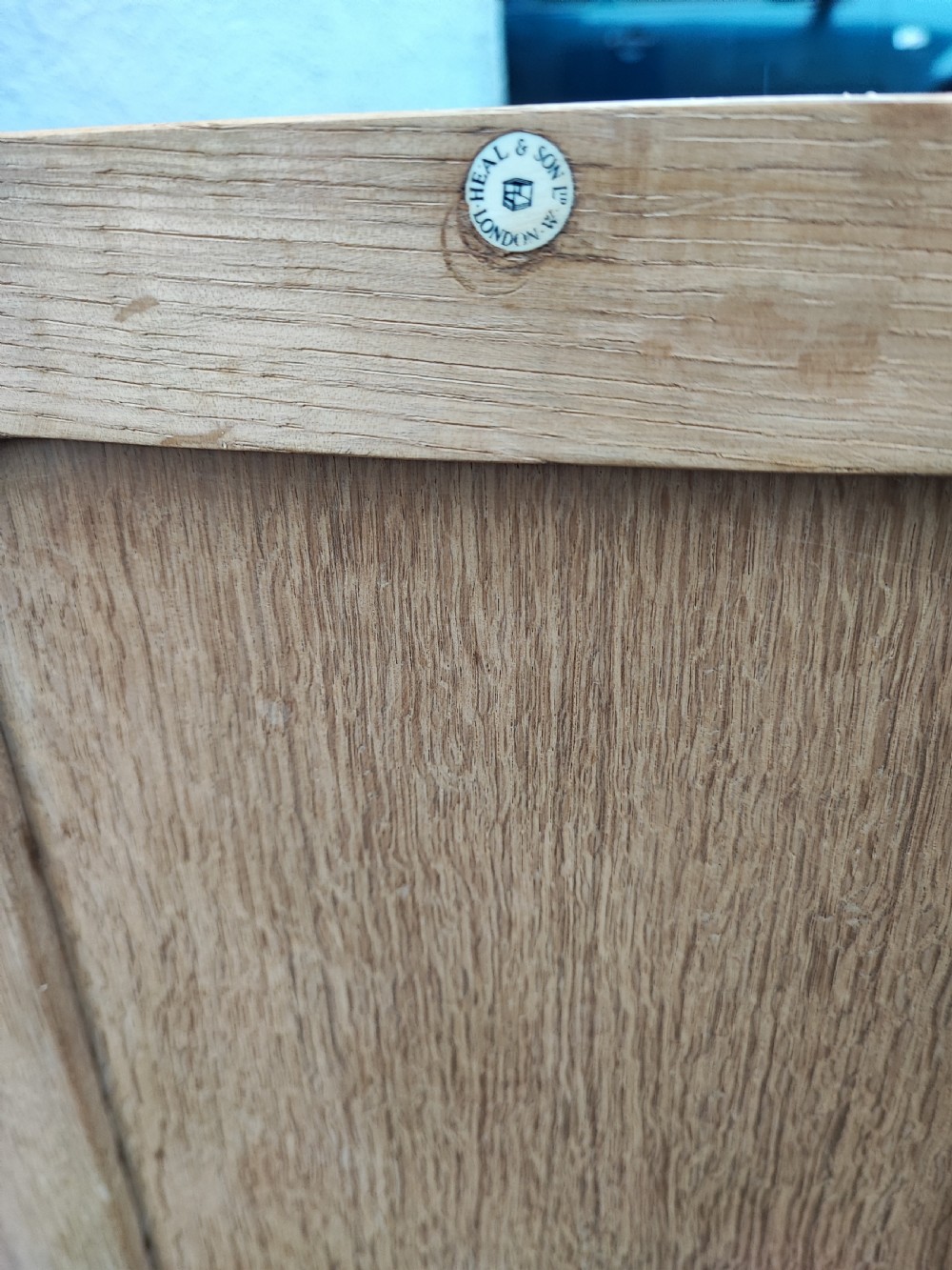 A slim oak open bookcase by Heals of London. View VI