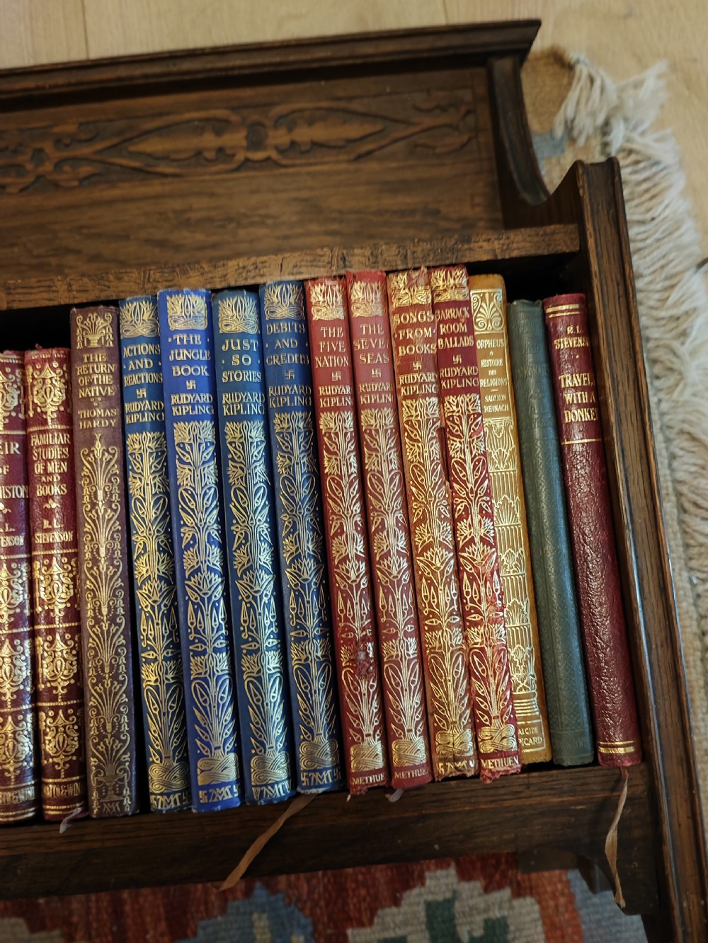 Art's and crafts oak table bookshelf with a collection of 28 classic novels. View II