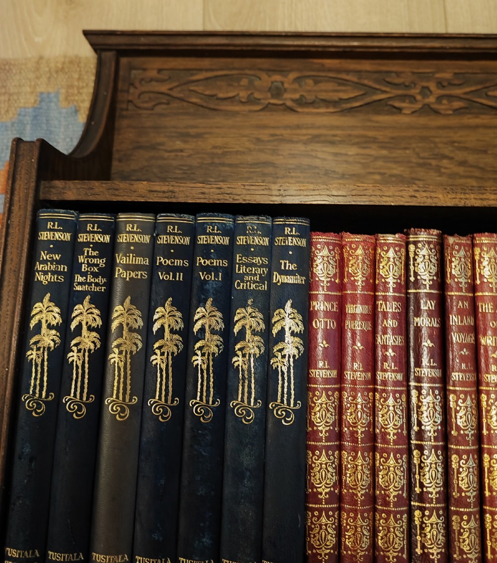 Art's and crafts oak table bookshelf with a collection of 28 classic novels. View VIII