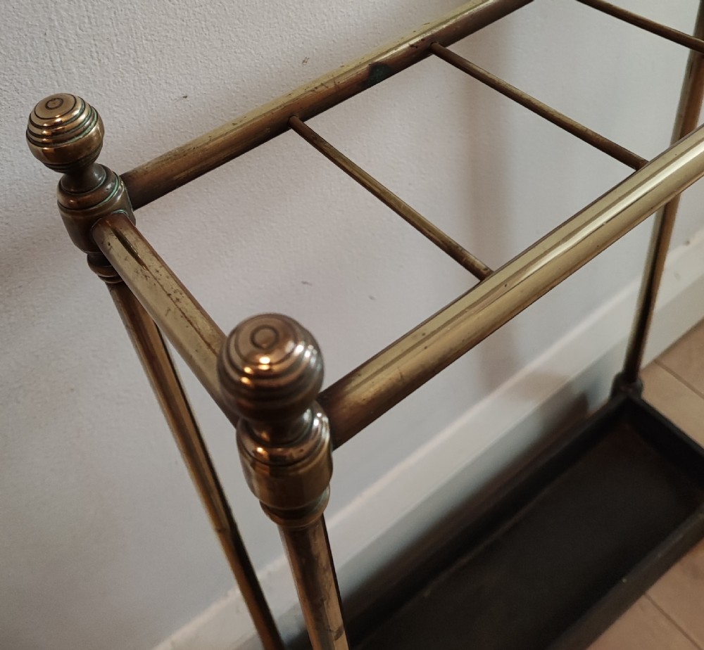 A 19c narrow 5 division Brass  and cast iron umbrella stand. View II