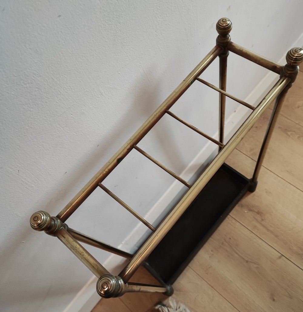 A 19c narrow 5 division Brass  and cast iron umbrella stand. View IV
