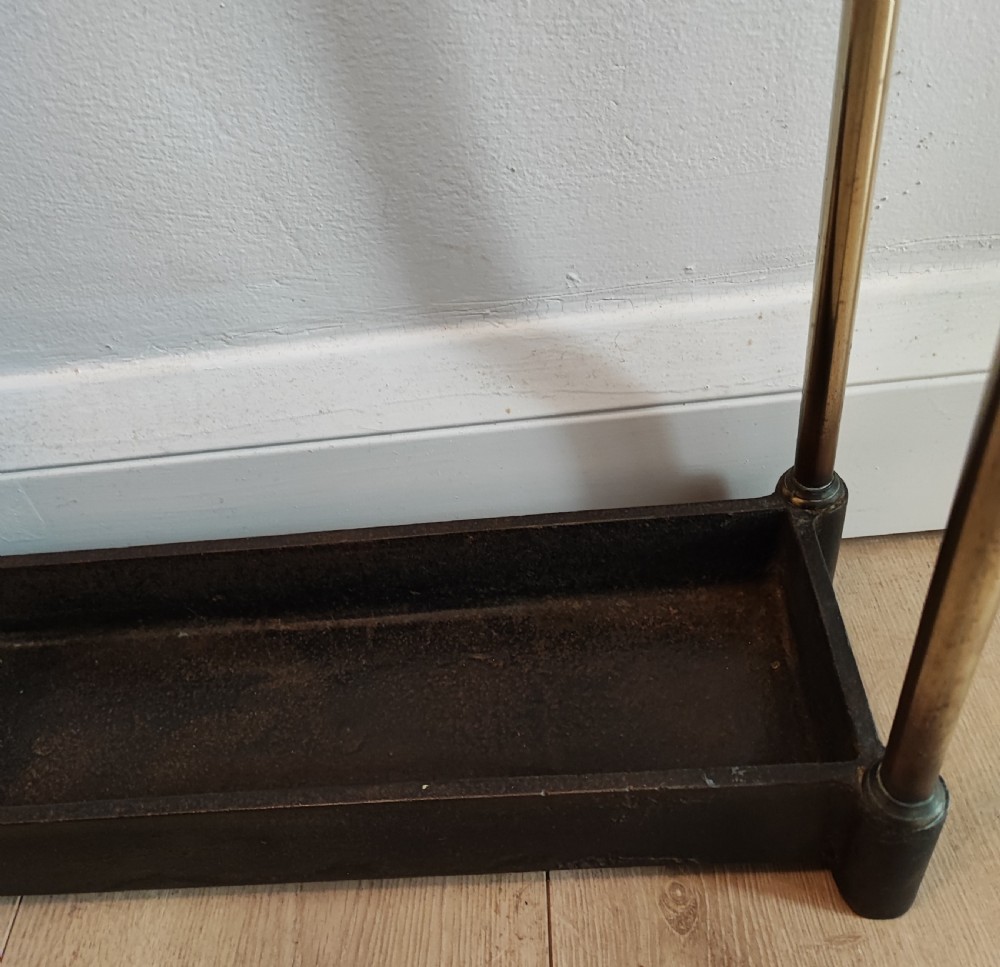 A 19c narrow 5 division Brass  and cast iron umbrella stand. View IX
