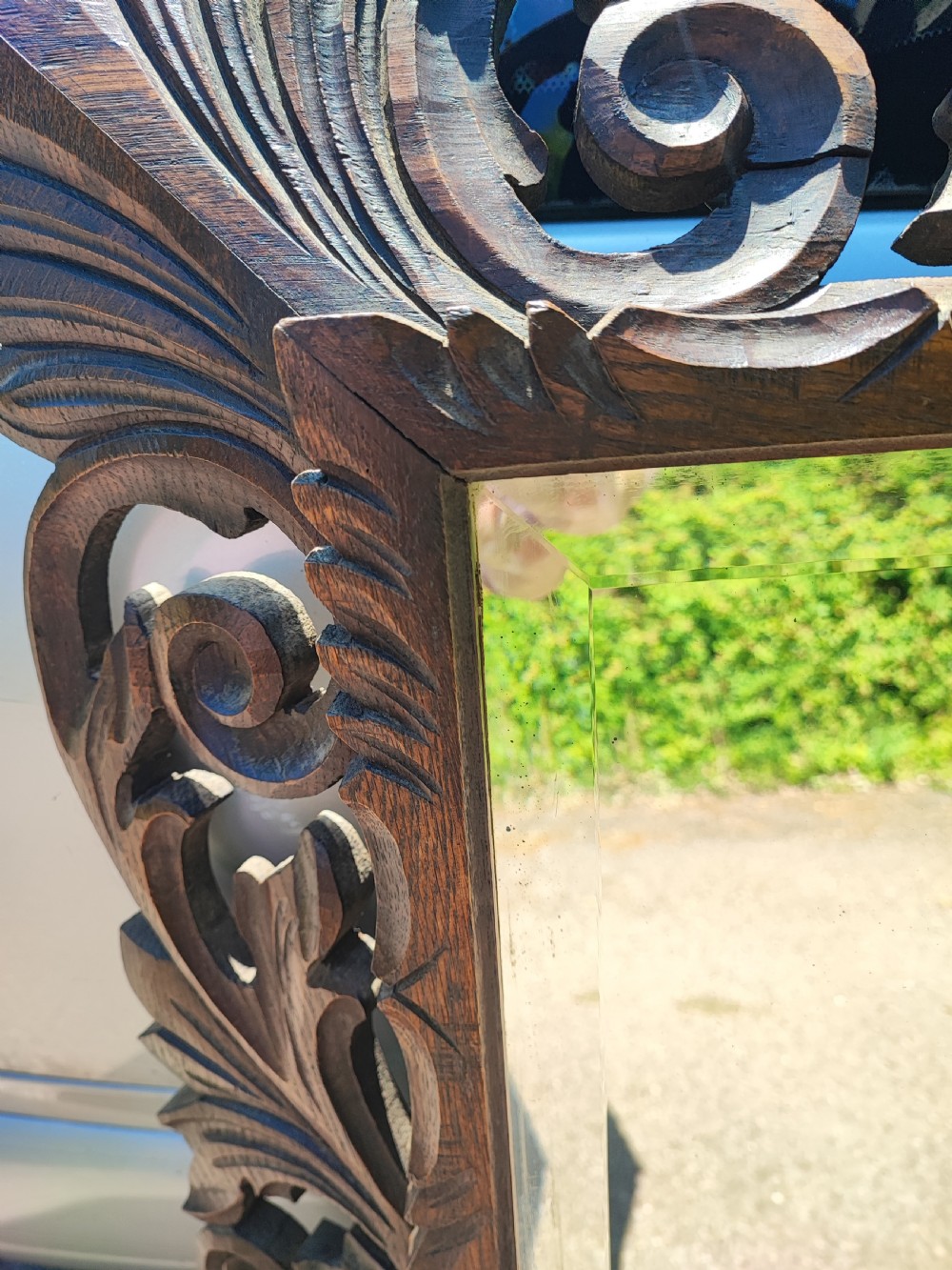 Antique large and impressive french  carved cushioned oak framed mirror. View VIII