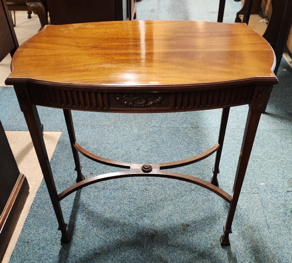 An antique carved Adams style mahogany lamp or side table.