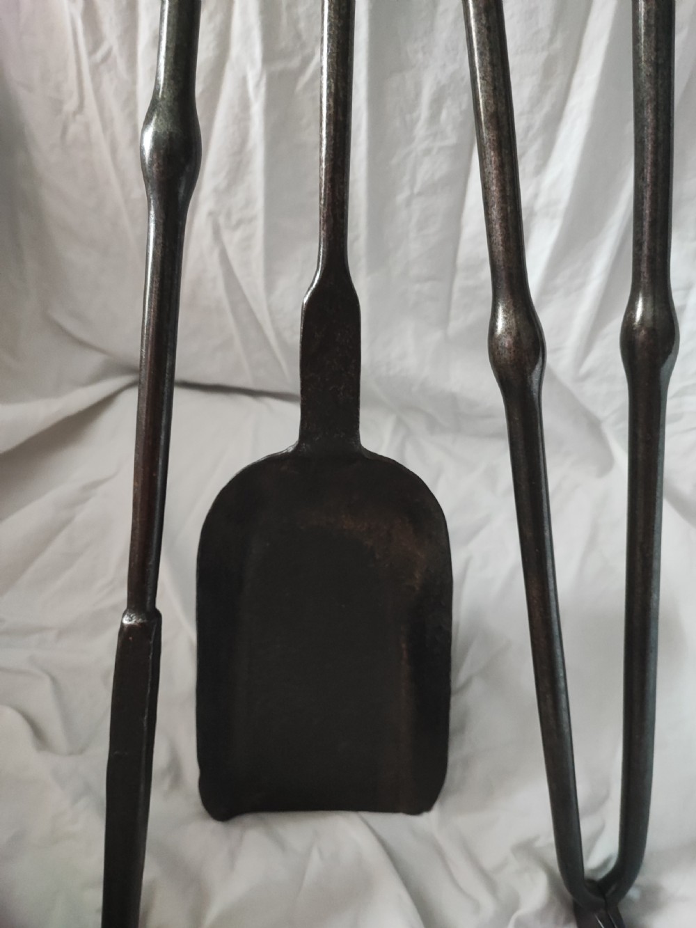 A George III set of polished steel fire irons View II