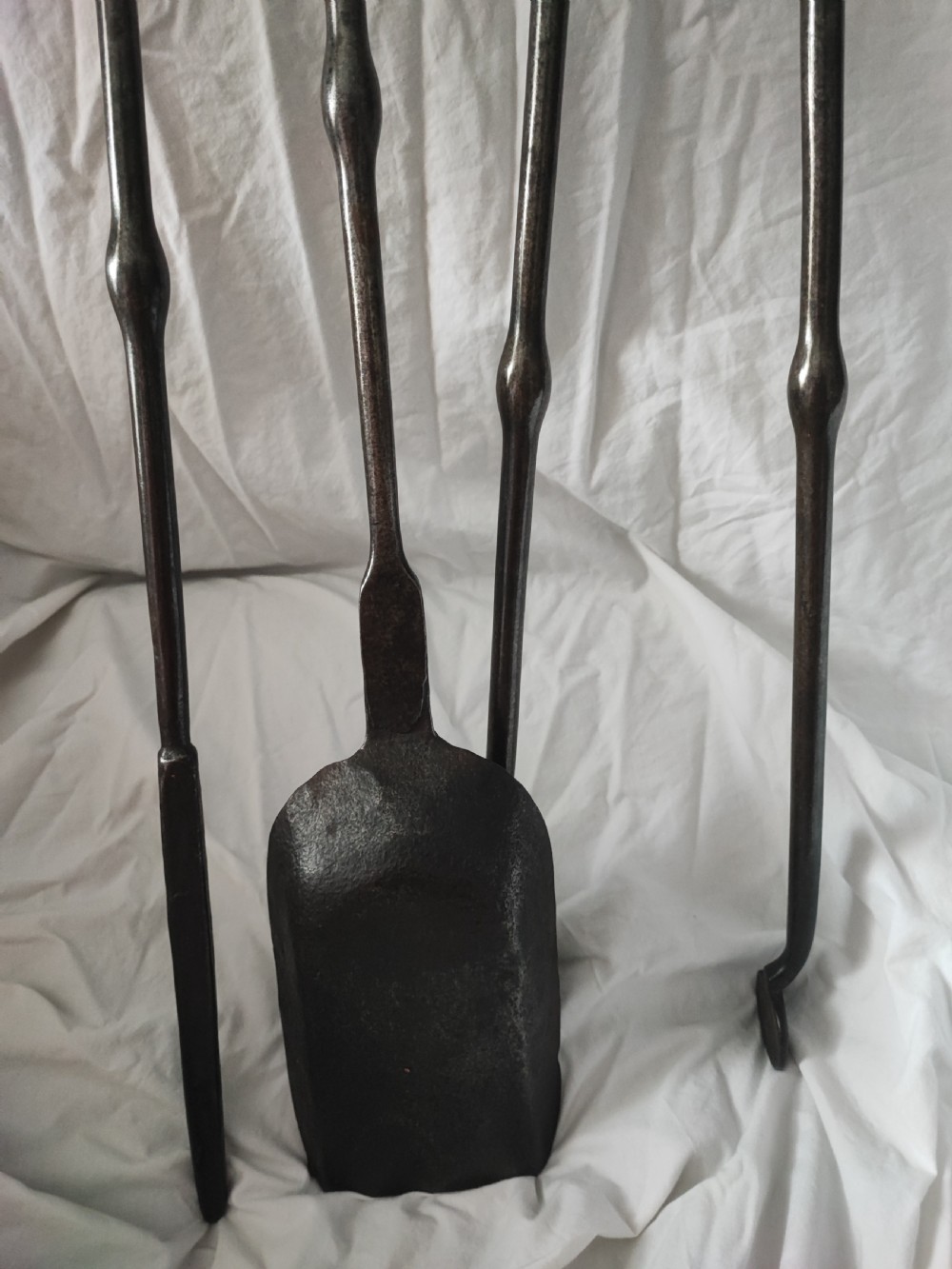 A George III set of polished steel fire irons View VI
