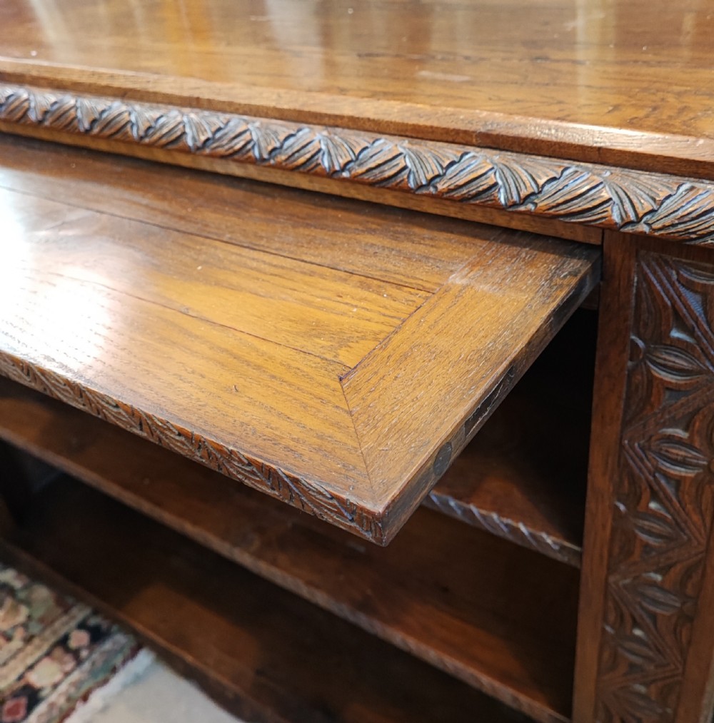 19c carved oak open bookcase. View XI